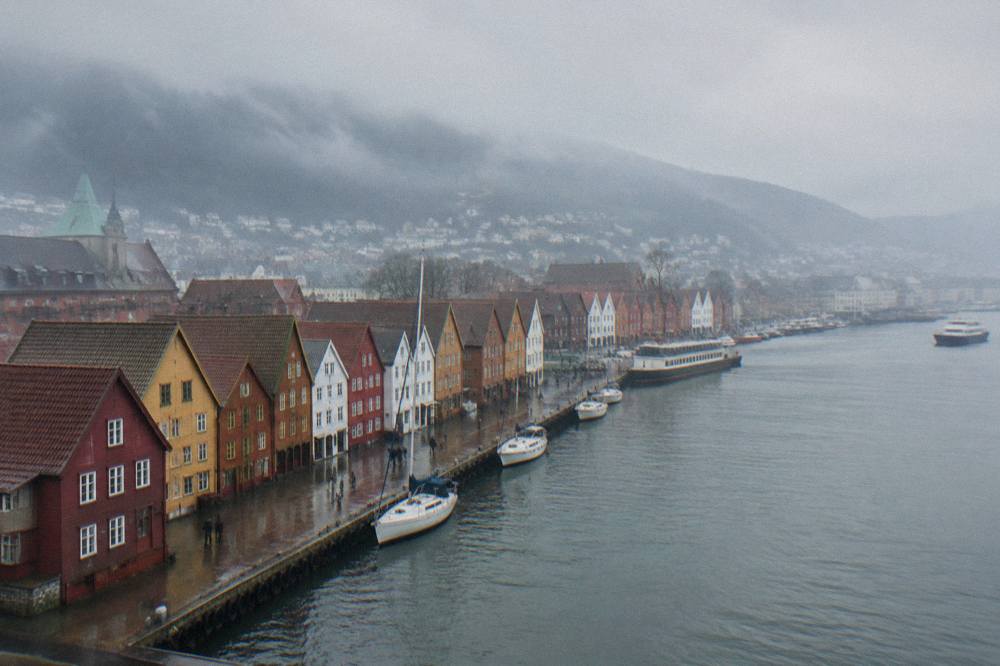 Colourful wooden Hanseatic buildings along the wharf in Bergen on an overcast day