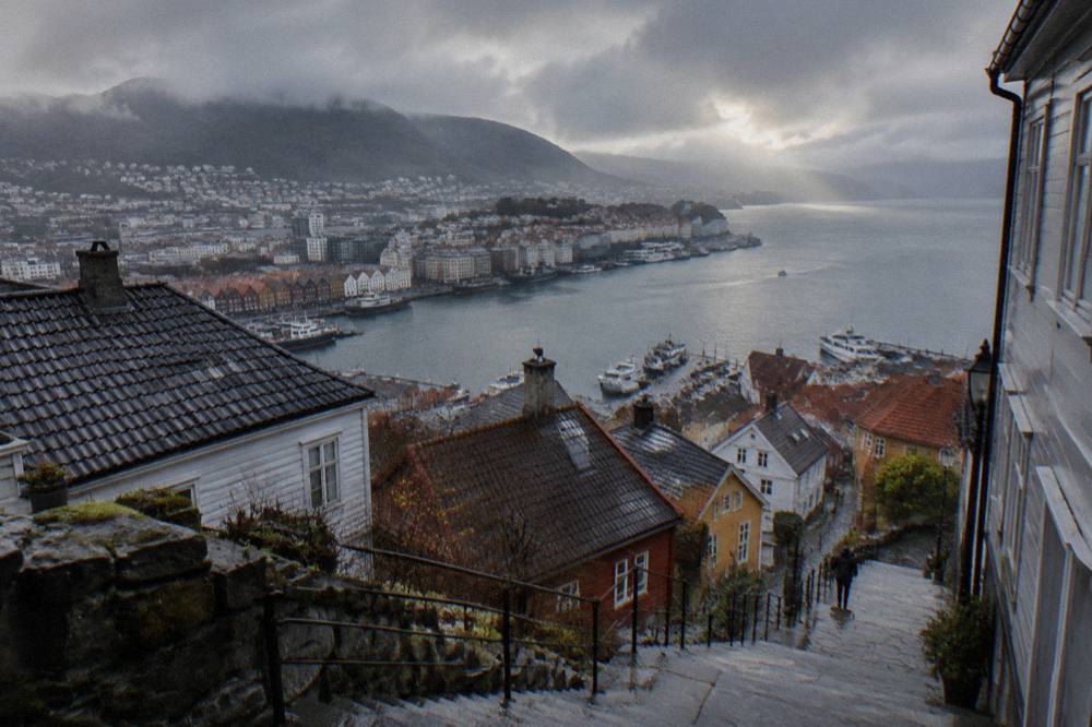 Rain clouds breaking over the wooden rooftops and harbour of Bergen