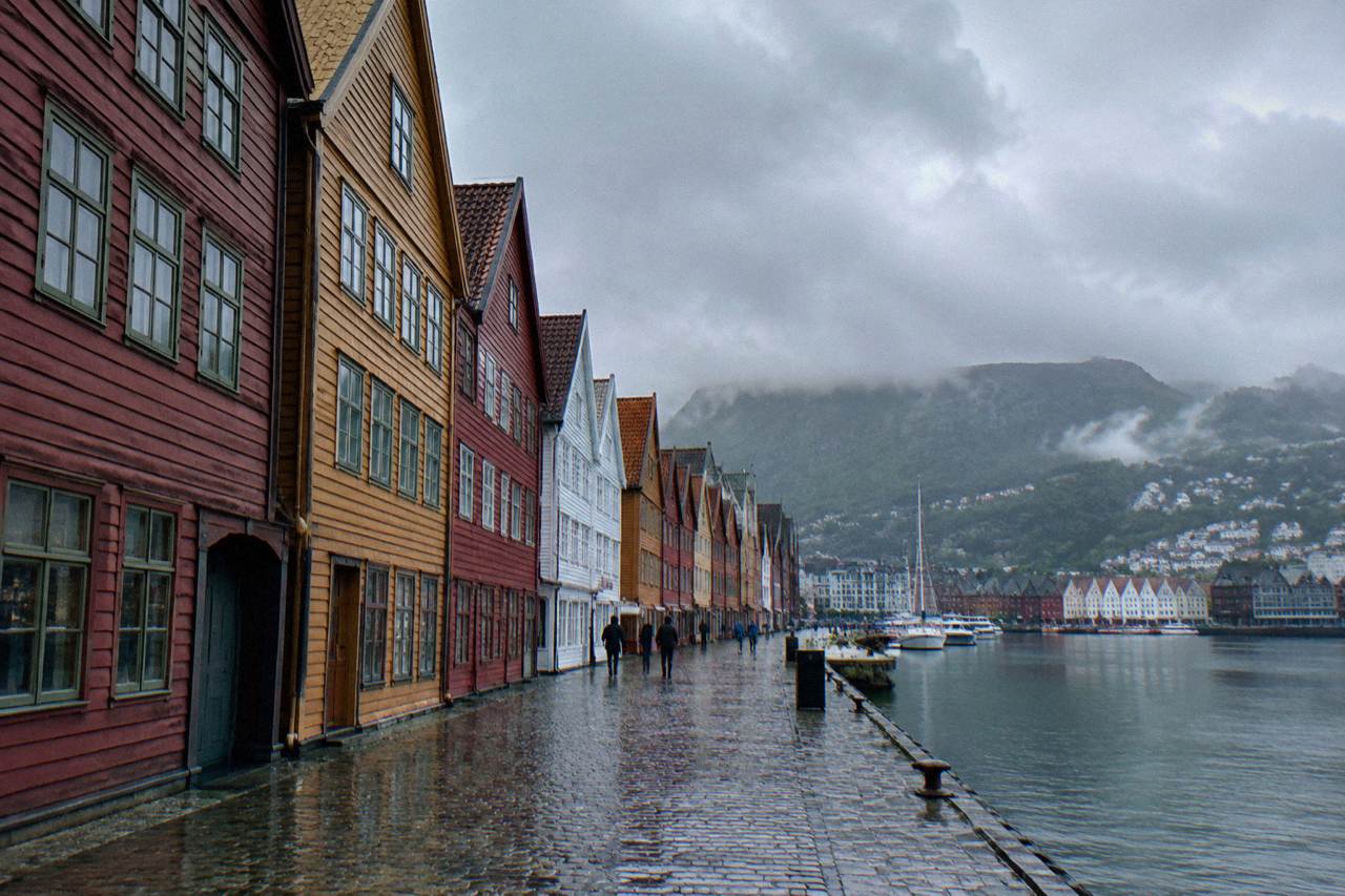 Colourful wooden Hanseatic buildings along the Bryggen wharf in Bergen on an overcast day