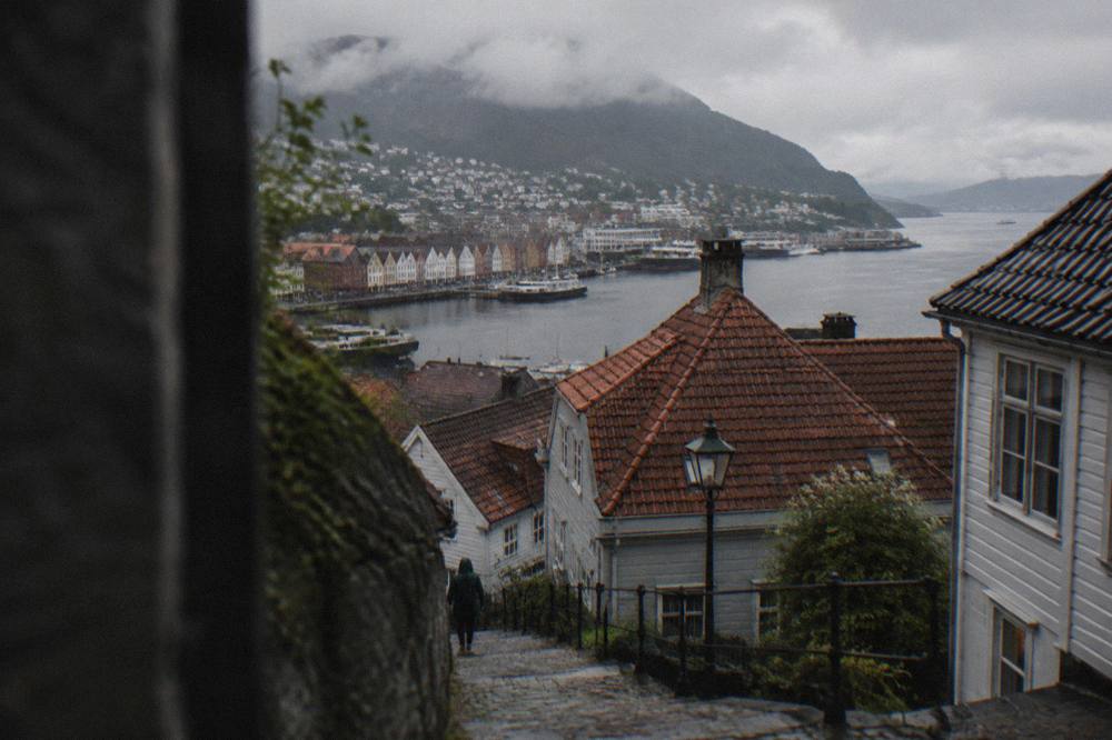 View over rooftops and cobbled streets toward the Bergen harbourfront