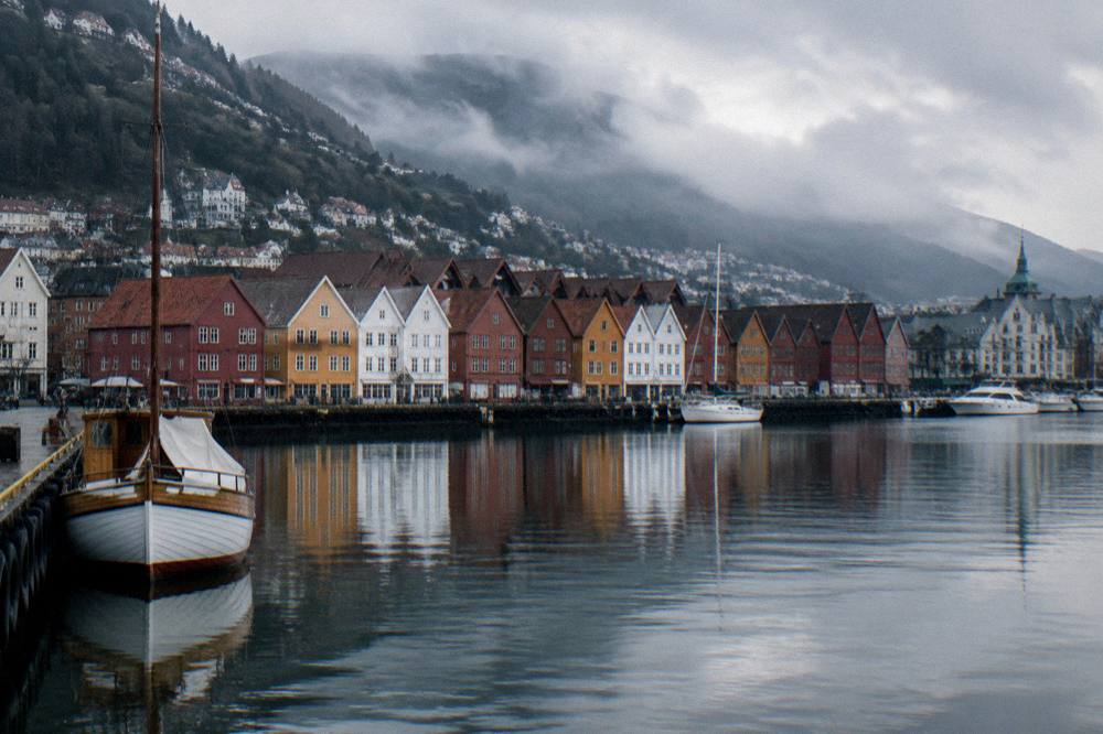 Bergen harbour with wooden Hanseatic buildings reflected in still water