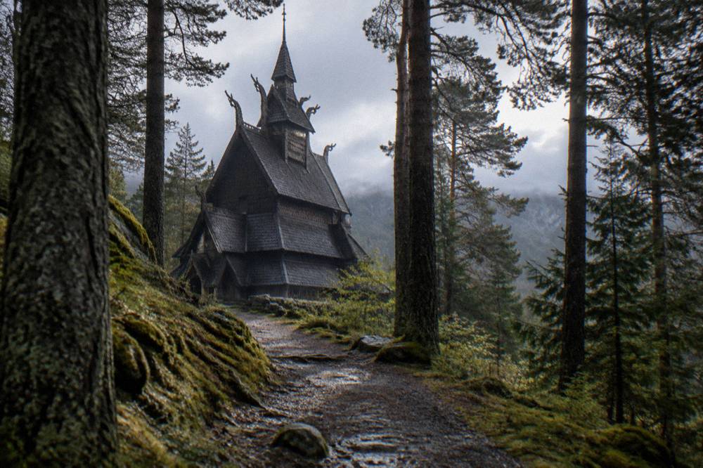 A forest path with packed earth and mossy stones leading toward a dark wooden church gable between trees