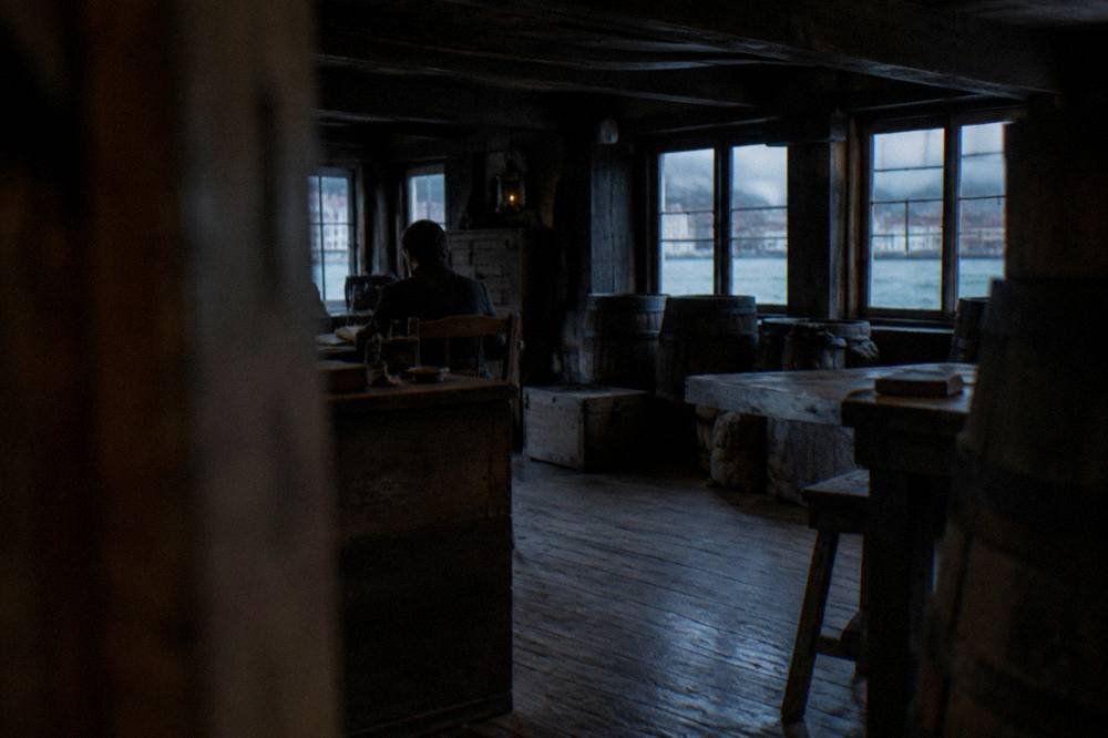 Interior of a Hanseatic merchant office with wooden desks and ledgers