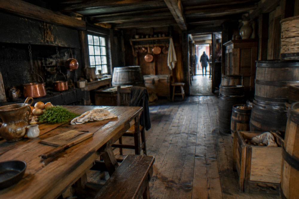 Merchant kitchen with copper pots and wooden furniture in a Hanseatic house