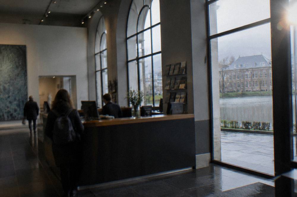 Ticket counter and information desk inside a modern Norwegian art museum