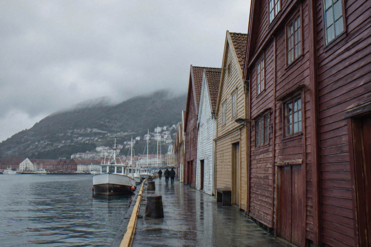 Historic wooden warehouse buildings on the Bergen harbour waterfront on an overcast day