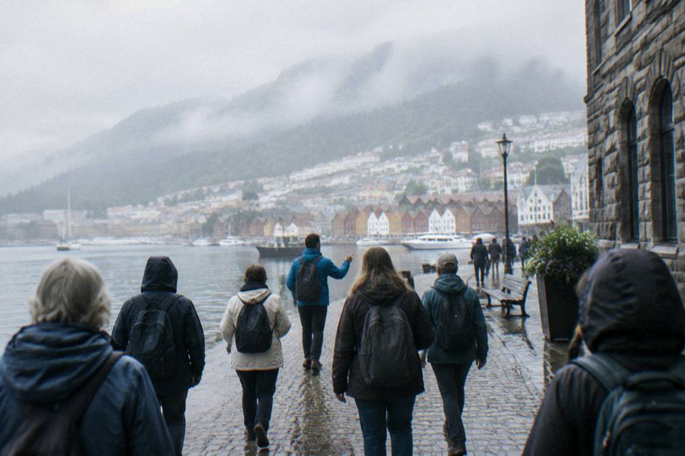 A tour group with a guide walking on cobblestones in central Bergen