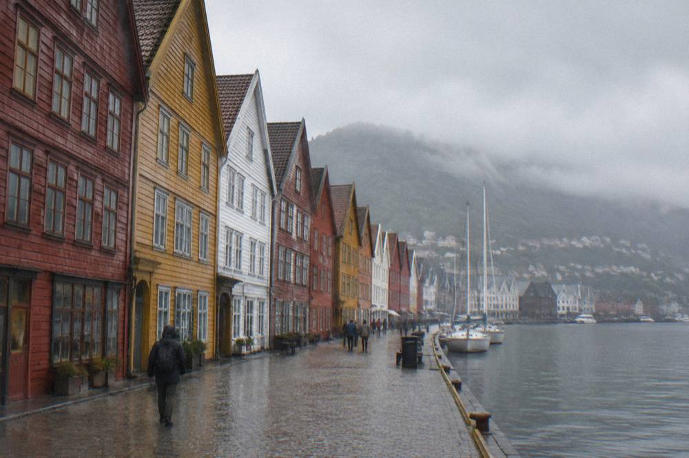 Colourful Hanseatic timber buildings along the Bryggen wharf in Bergen with soft evening light