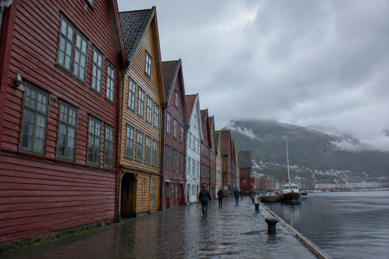 Colourful wooden Hanseatic buildings along the Bryggen wharf in Bergen on an overcast day