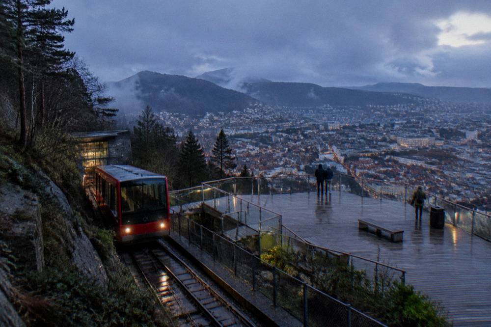 The Fløibanen funicular station in Bergen with a red carriage at the platform