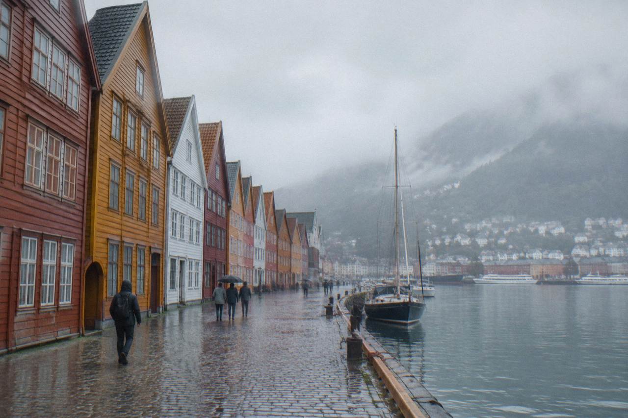 Colourful wooden gable warehouses of the old Bryggen wharf standing along Bergen harbour
