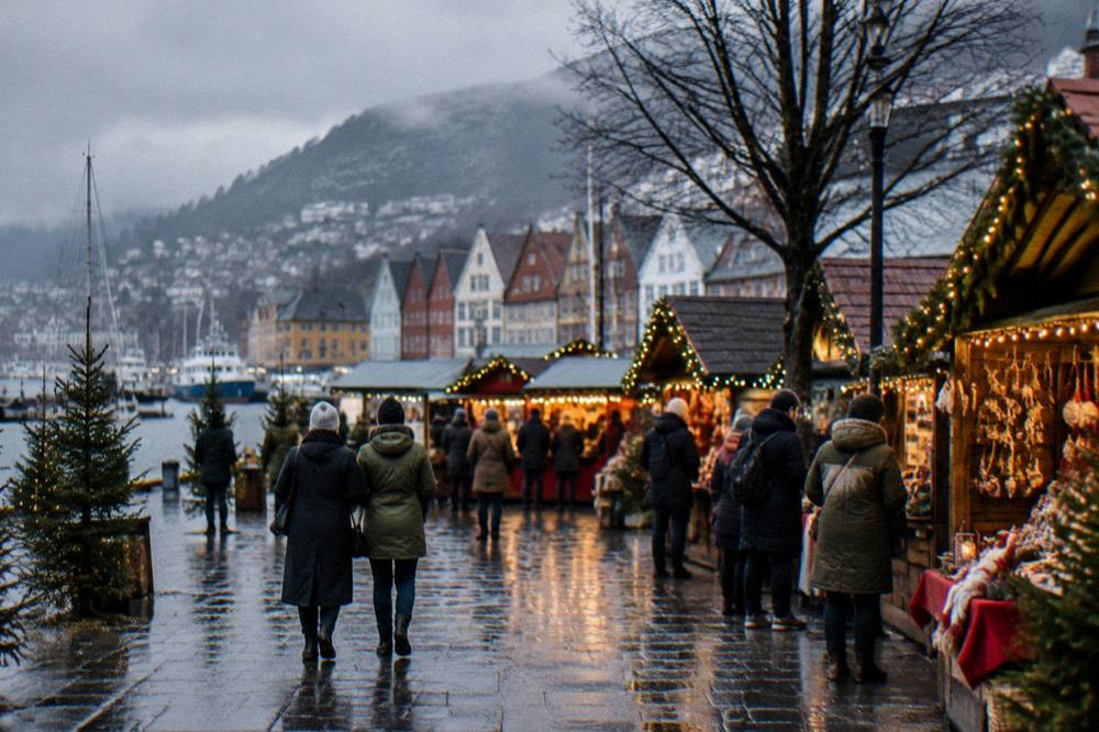 Christmas market stalls glowing with warm lights at a city square