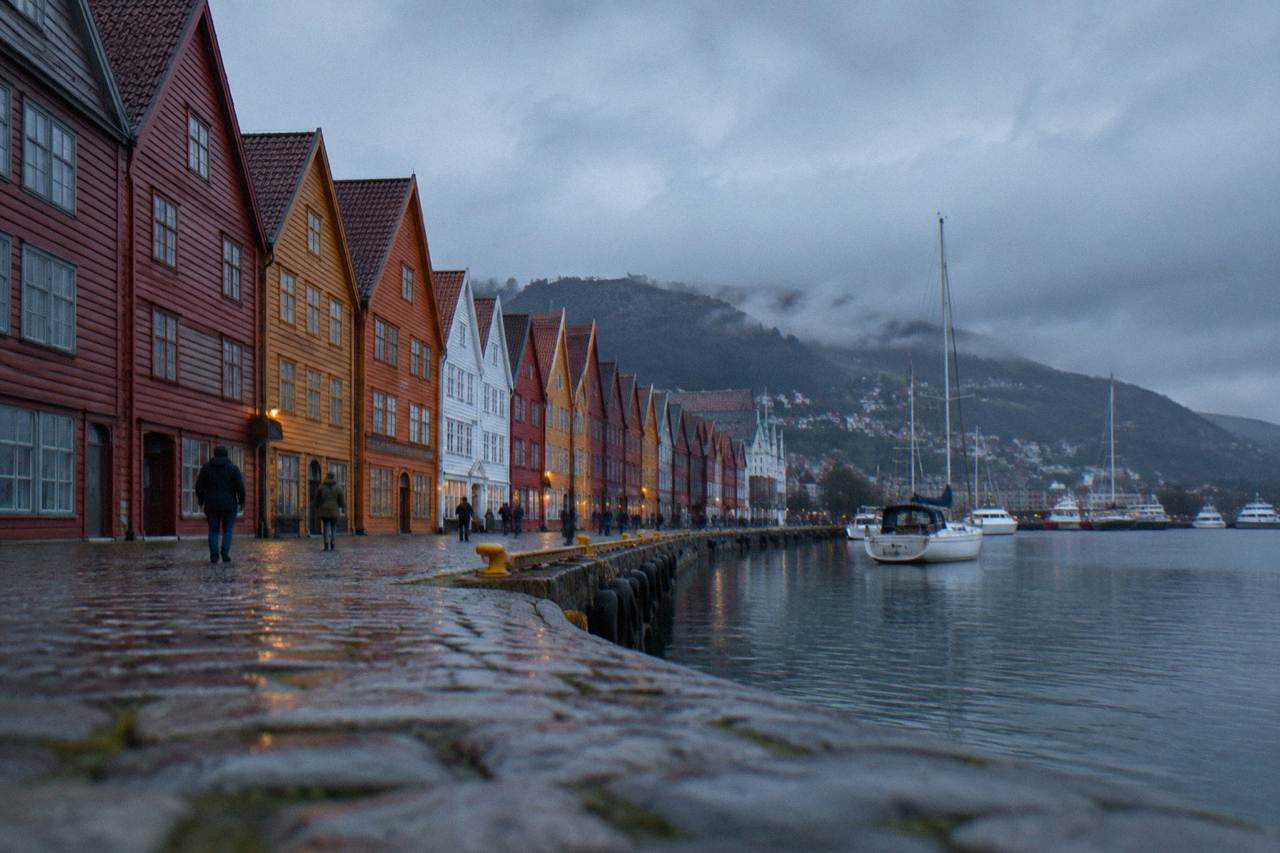 Colourful wooden Hanseatic buildings along the Bryggen wharf in Bergen on an overcast day