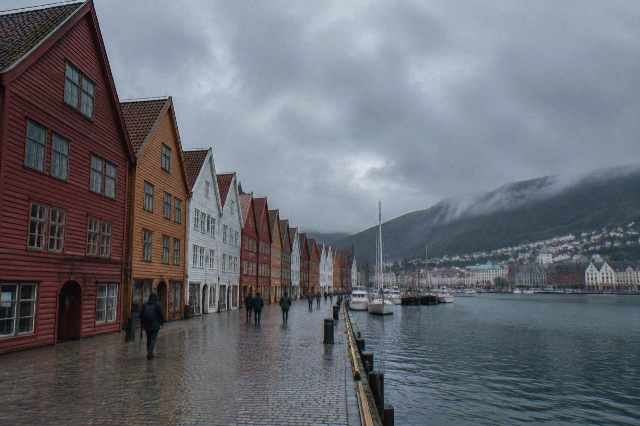 Colorful wooden Hanseatic buildings along the Bryggen wharf in Bergen on an overcast day