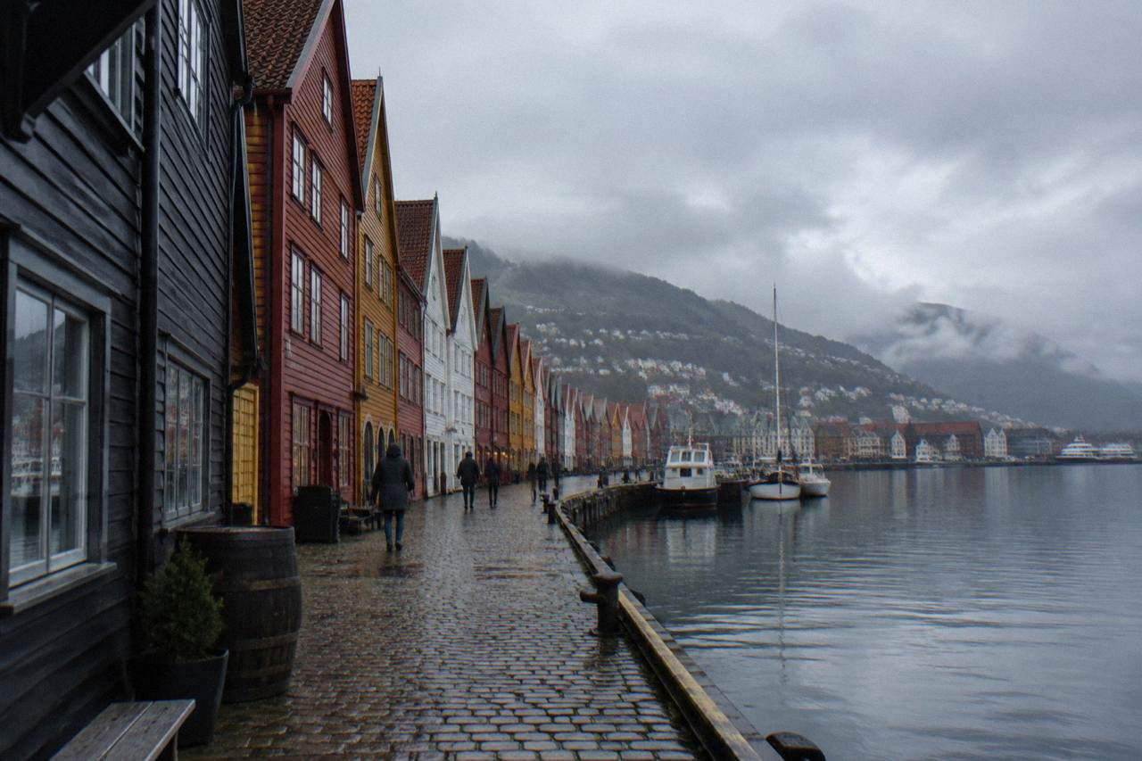 Colourful wooden hanseatic buildings along the Bryggen wharf in Bergen on a calm, overcast day