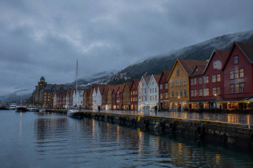 Colourful wooden Hanseatic buildings along the wharf in Bergen on an overcast day