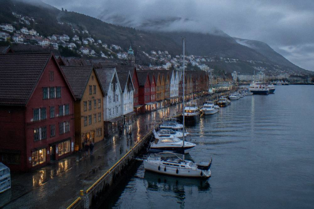 A waterfront row of colourful wooden buildings along the harbour in Bergen