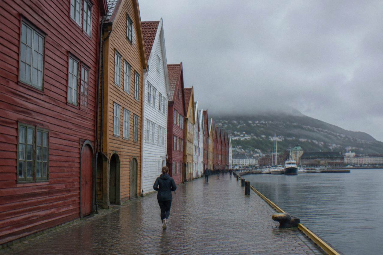 Colourful wooden Hanseatic trade buildings along the Bryggen wharf in Bergen on an overcast day