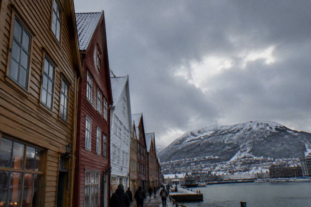 Snow-dusted rooftops of Bergen's wooden Hanseatic buildings on a cold winter day