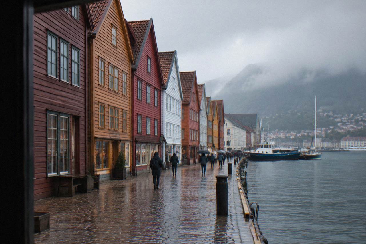 Colorful wooden shop fronts along the Bryggen wharf in Bergen on a bright day