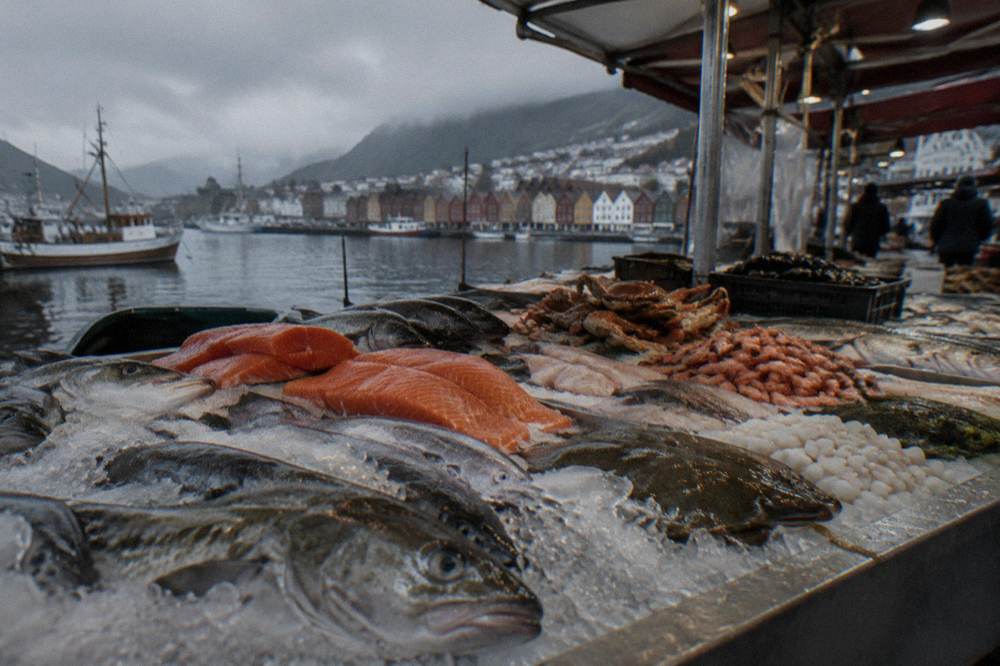 Fresh fish and seafood displayed on ice at a covered market counter in Bergen